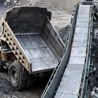 Mining material handling steel